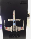 Star Wars T-65 X-Wing starfighter drone model with four landing gear struts, displayed open