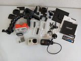 GoPro HERO 3+ Black action camera kit with mounts, cases, batteries, and cables