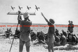 Vintage German anti-aircraft photo: soldiers studying aircraft beside prop plane