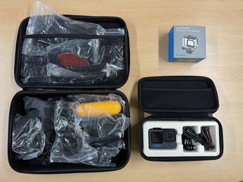 Action camera accessory kit in black hard case with action camera and mounts