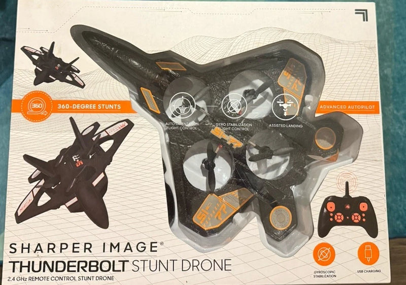 Remote control stunt drone with boxed Thunderbolt design and orange buttons, ready to fly