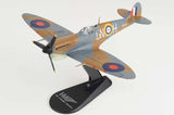 Spitfire model aircraft on black display stand, gray-blue and tan with roundels