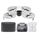 Compact white quadcopter drone with camera, remote controller, batteries, prop guards, bag