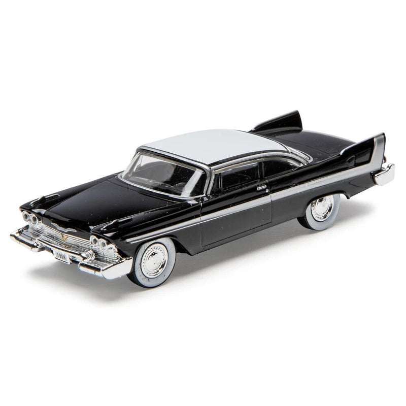 Black die-cast 1:48 model car with white roof, chrome trim and whitewall tires