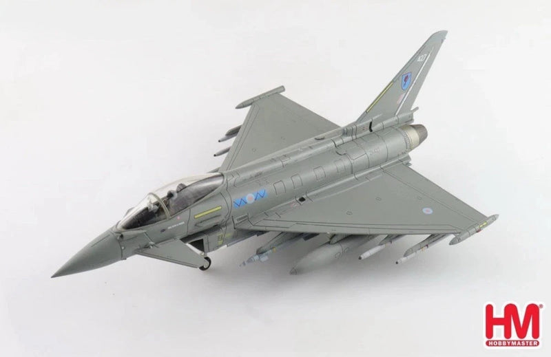 Gray fighter jet model with underwing missiles and twin tail, side angle view