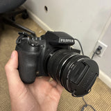 Black Fujifilm FinePix HS35 EXR digital camera with attached 24–720mm lens