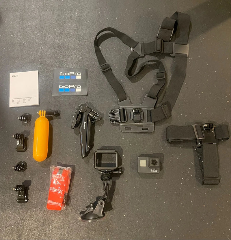 GoPro HERO7 black action camera set with head strap, mounts, and accessory pieces