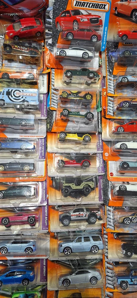 Assorted Matchbox vintage-style toy car blister packs, various colors, multiple models