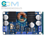 DC-DC converter module with blue PCB, copper inductor coil, heatsinks, terminal blocks