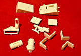 1/25 battery box parts in off-white plastic, small molded pieces
