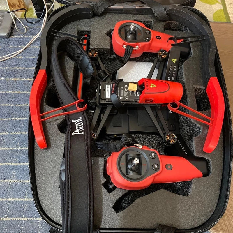 Drone parts repair lot in case, red and black quadcopter arms and camera modules