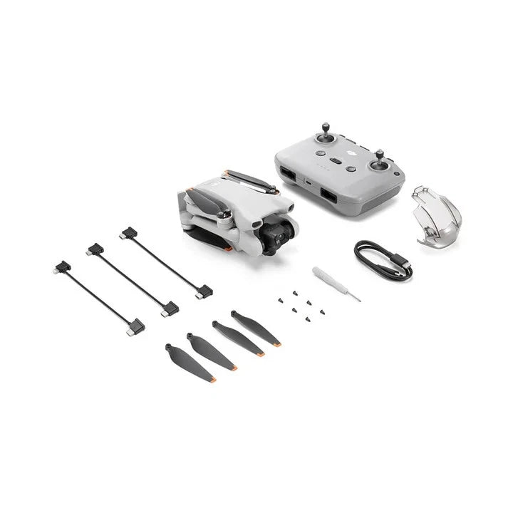 DJI Mini 3 drone kit with controller, cables, propellers, and landing gear