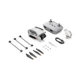 DJI Mini 3 drone kit with controller, cables, propellers, and landing gear