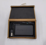 FlyCamOne battery pack with cables and connector, shown in open box