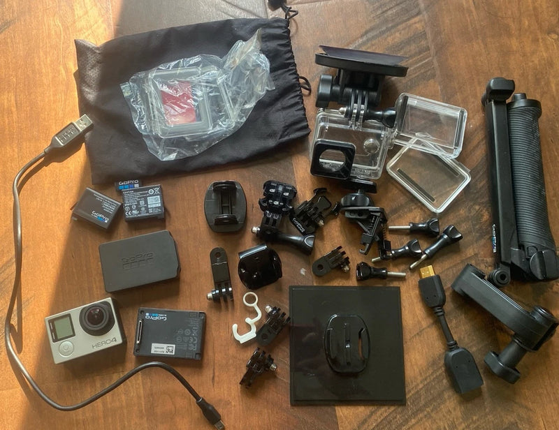 GoPro HERO4 action camera accessories kit with mounts, housing, batteries and grip