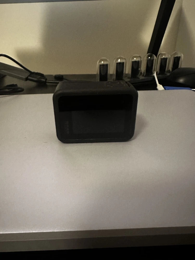 Black action camera with front display screen