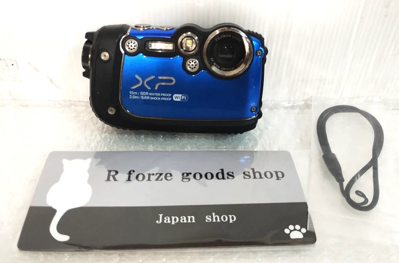 FUJIFILM digital camera with blue panel and black body, front lens and controls visible