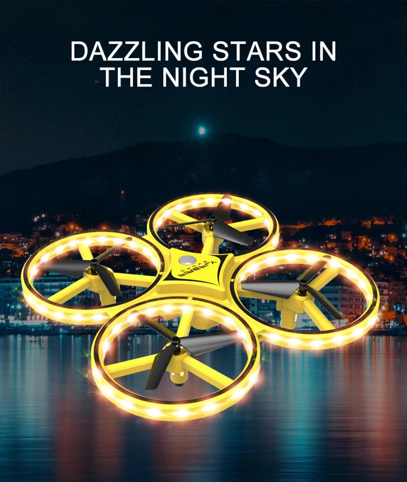 Mini yellow quadcopter drone with glowing LED rings and four propellers
