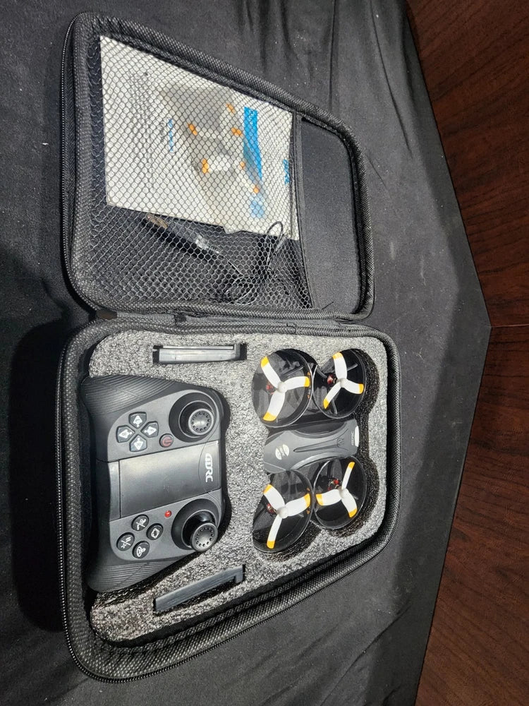 Black drone quadcopter case with controller and two propeller-guarded rotors