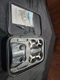 Black drone quadcopter case with controller and two propeller-guarded rotors