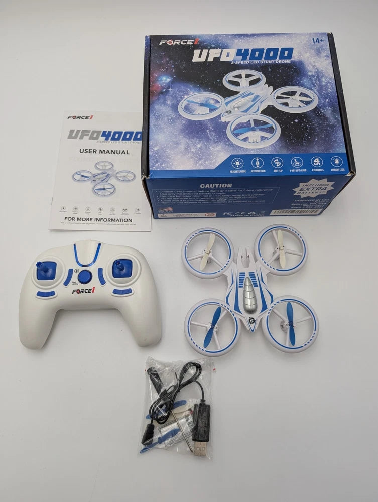 Toy UFO stunt drone set with box, blue controller, and four propeller arms