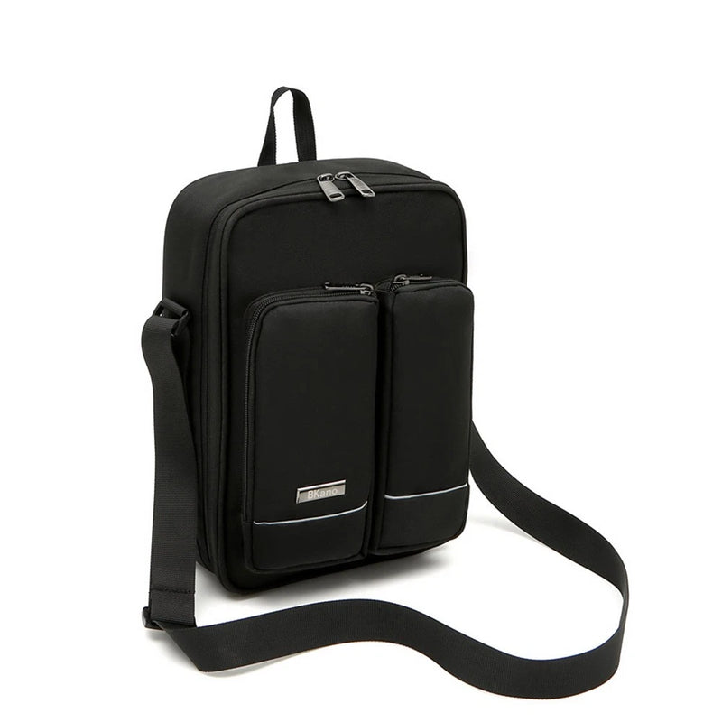 Black shoulder bag with front zip pockets and adjustable shoulder strap.