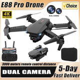 Black RC drone with dual camera, four propellers, remote controller and carrying case