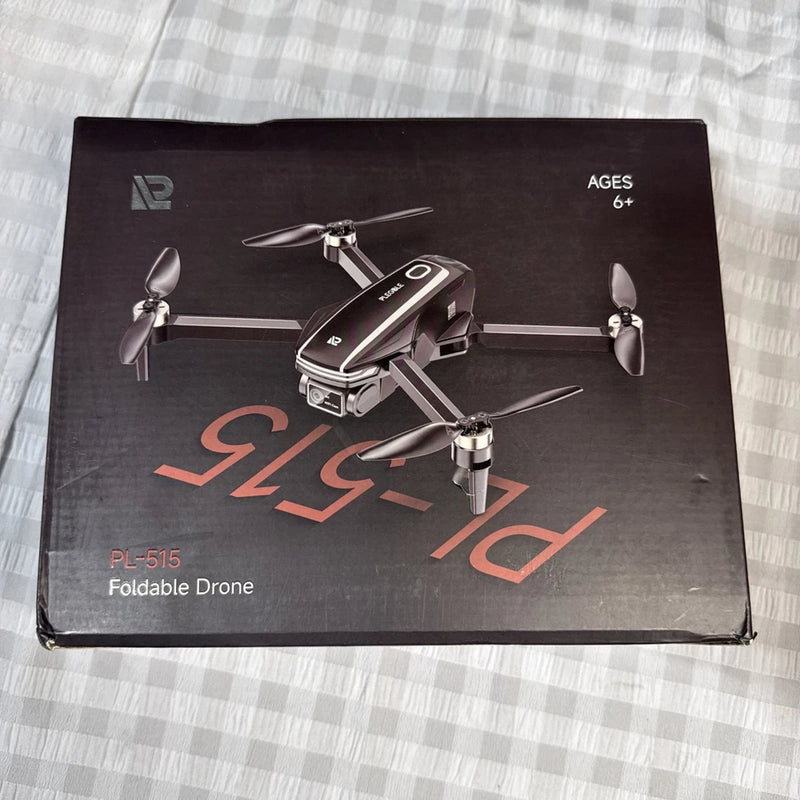 Foldable drone packaging showing black quadcopter with propellers and LED lights