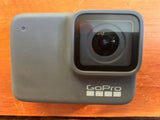 GoPro HERO7 waterproof action camera with front lens and GoPro logo, silver gray body
