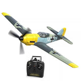 Yellow and gray RC warbird airplane with remote transmitter