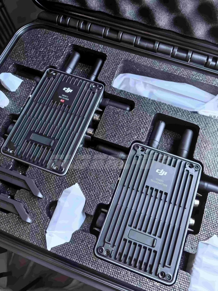 DJI transmission modules with ribbed antennas and ports in protective case