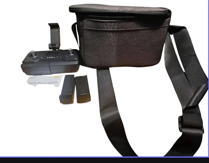 GPS drone controller with batteries and black carrying pouch, shoulder strap