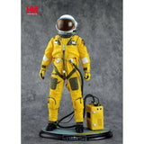 Hobby Master pilot figure statue in yellow flight suit, helmet visor, backpack, on round base.