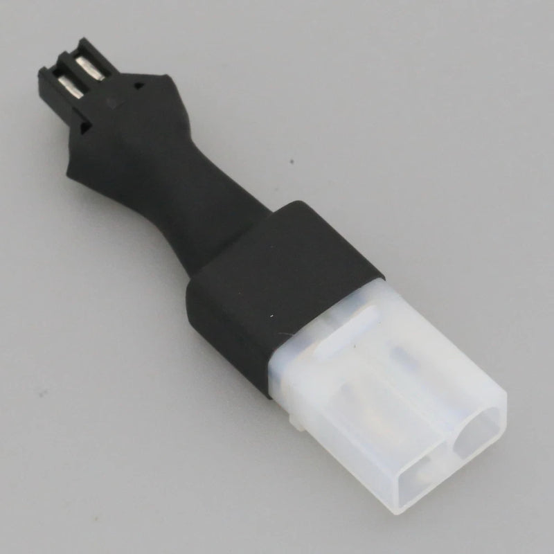 RC battery adapter plug with black housing and white Tamiya male connector