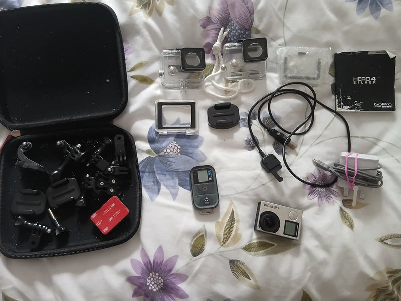 GoPro HERO4 action camera waterproof bundle with remote, mounts, charger and extra battery