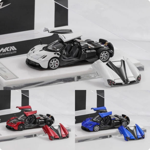 1:64 die-cast Pagani coupe model set: black car with open hood, plus red and blue cars