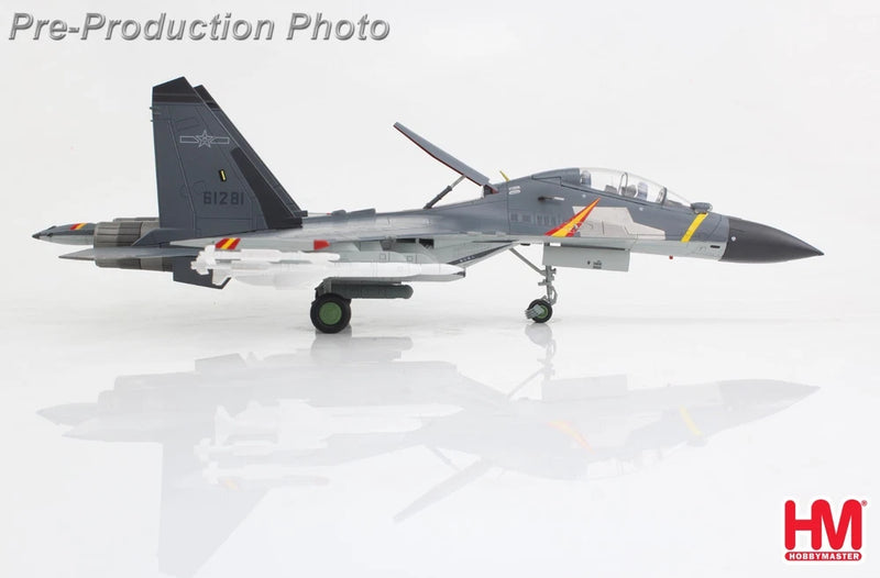 Scale model fighter jet with gray body, dark tail, and colorful markings on wings