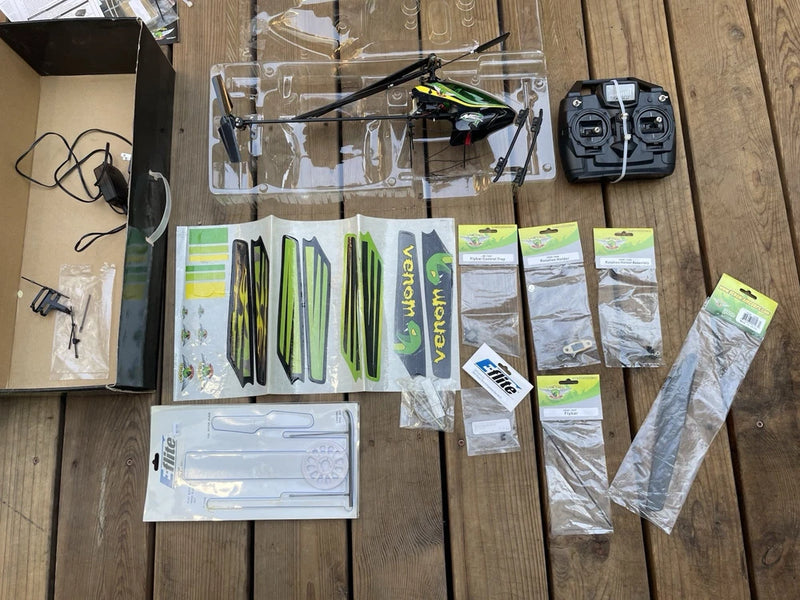 VENOM AIRCORPS micro RC helicopter kit with controller, rotor blades, and parts
