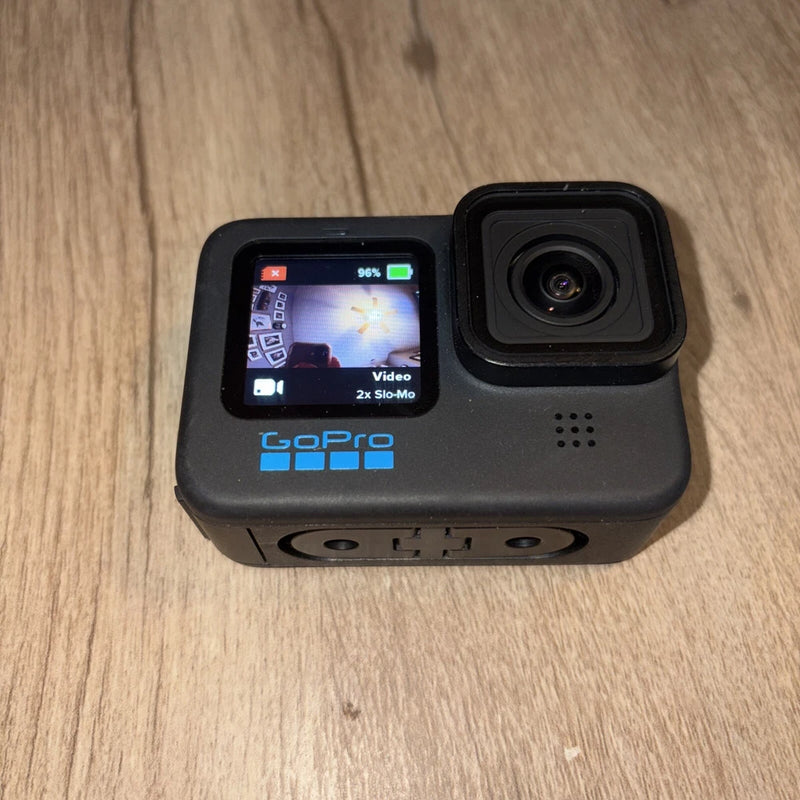 Black action camera with front screen showing video and GoPro logo