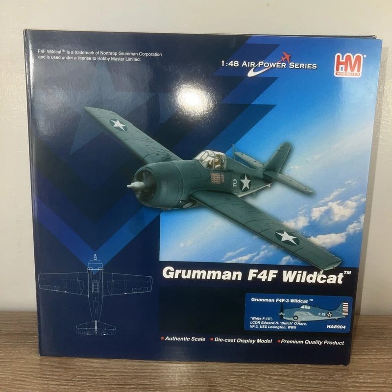 Grumman F4F Wildcat die-cast model aircraft in retail box, green fighter on cover