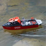 Red RC tugboat model with white control console and gray deck details