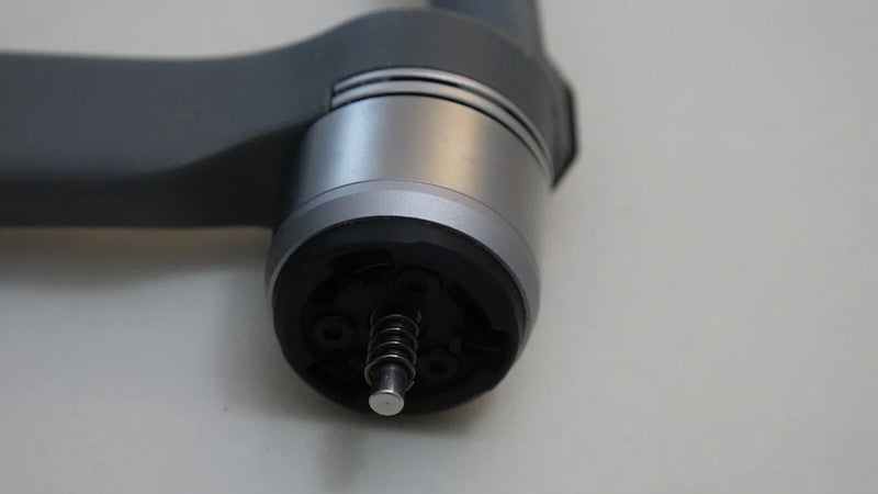 DJI drone front motor arm with cylindrical gray housing and exposed screw shaft
