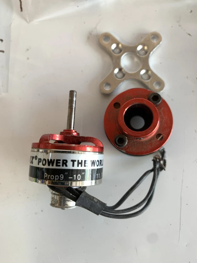 Mini drone motor assembly with red housing, shaft, mounting plate, and black wires