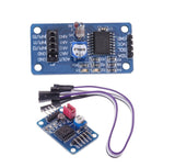 AD/DA conversion module PCB with IC, header pins, and purple jumper wires
