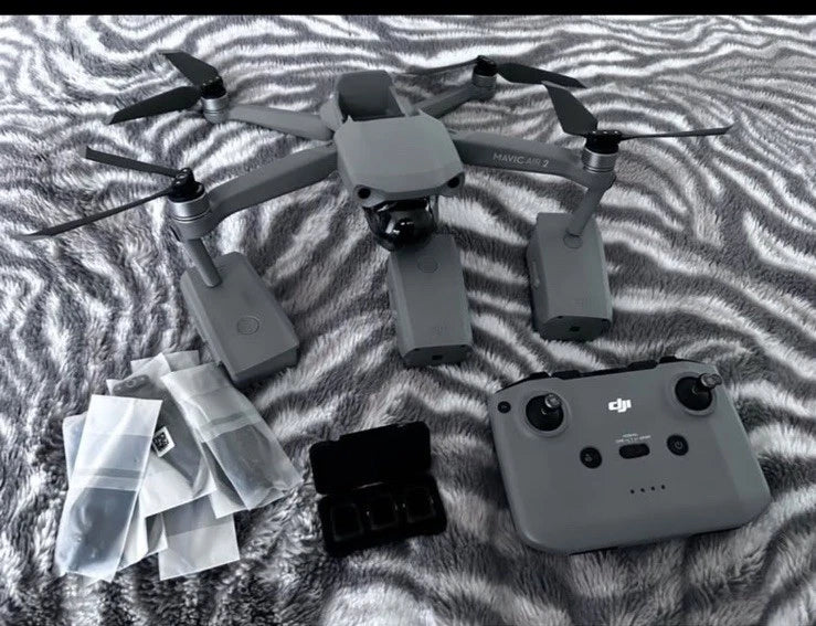 DJI Mavic Air 2 foldable camera drone with gray remote controller