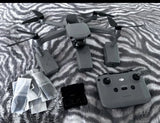 DJI Mavic Air 2 foldable camera drone with gray remote controller