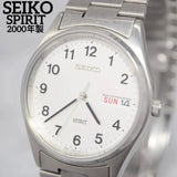 SEIKO Spirit men’s wristwatch, silver bracelet, white dial, day-date window.