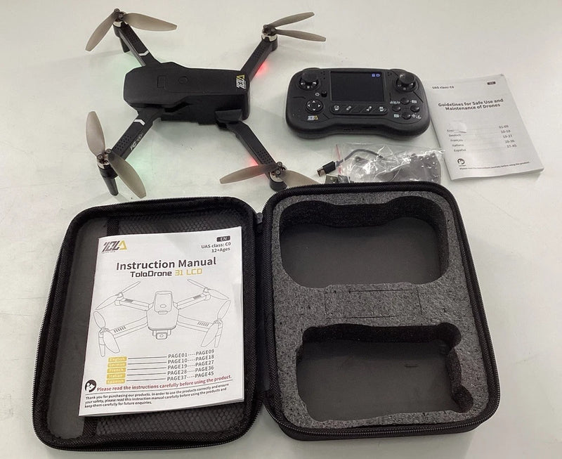 Foldable quadcopter drone with remote controller, manuals, and protective carrying case