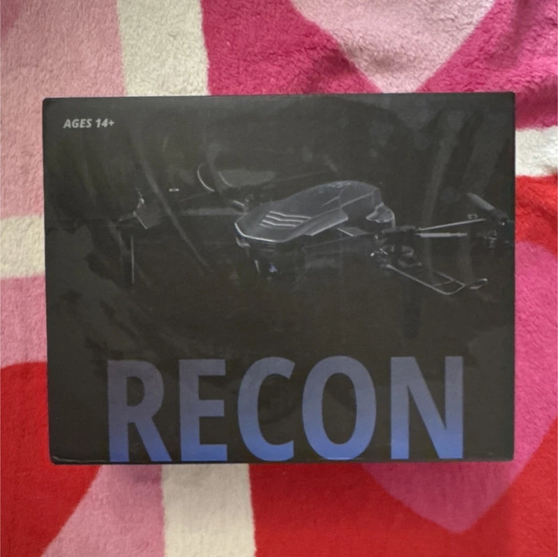 Black RECON drone retail box with quadcopter illustration and printed label