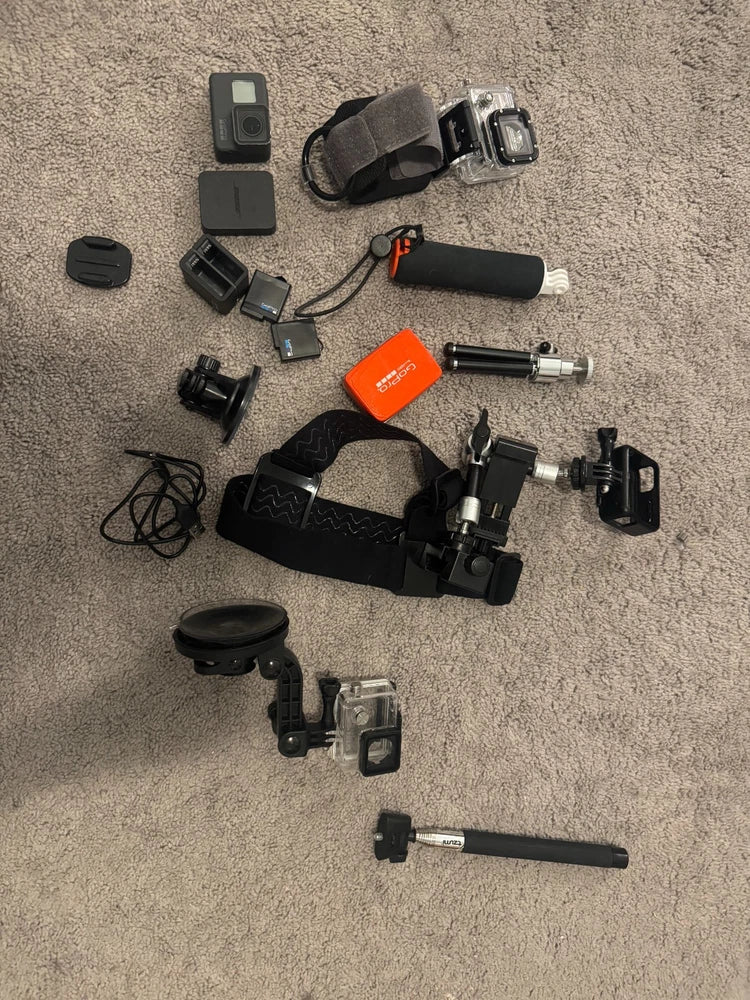 GoPro Hero 5 Black action camera bundle with mounts, case, battery and handle
